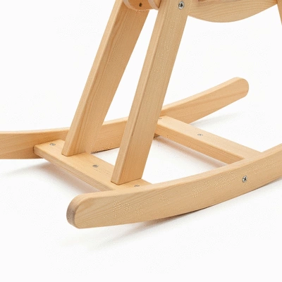 Close-up of a rocking horse base, illustrating a wide, stable design for child safety, no text, no words, no typography, no labels, clean image
